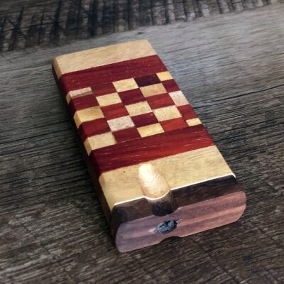 checkerboard one hitter dugout case sitting on wood table - product image